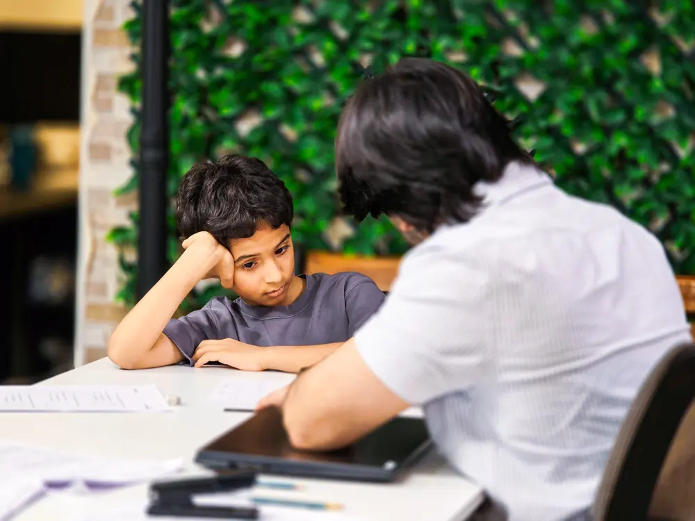 Lower secondary student in a focused one-to-one maths session at Improve ME Institute
