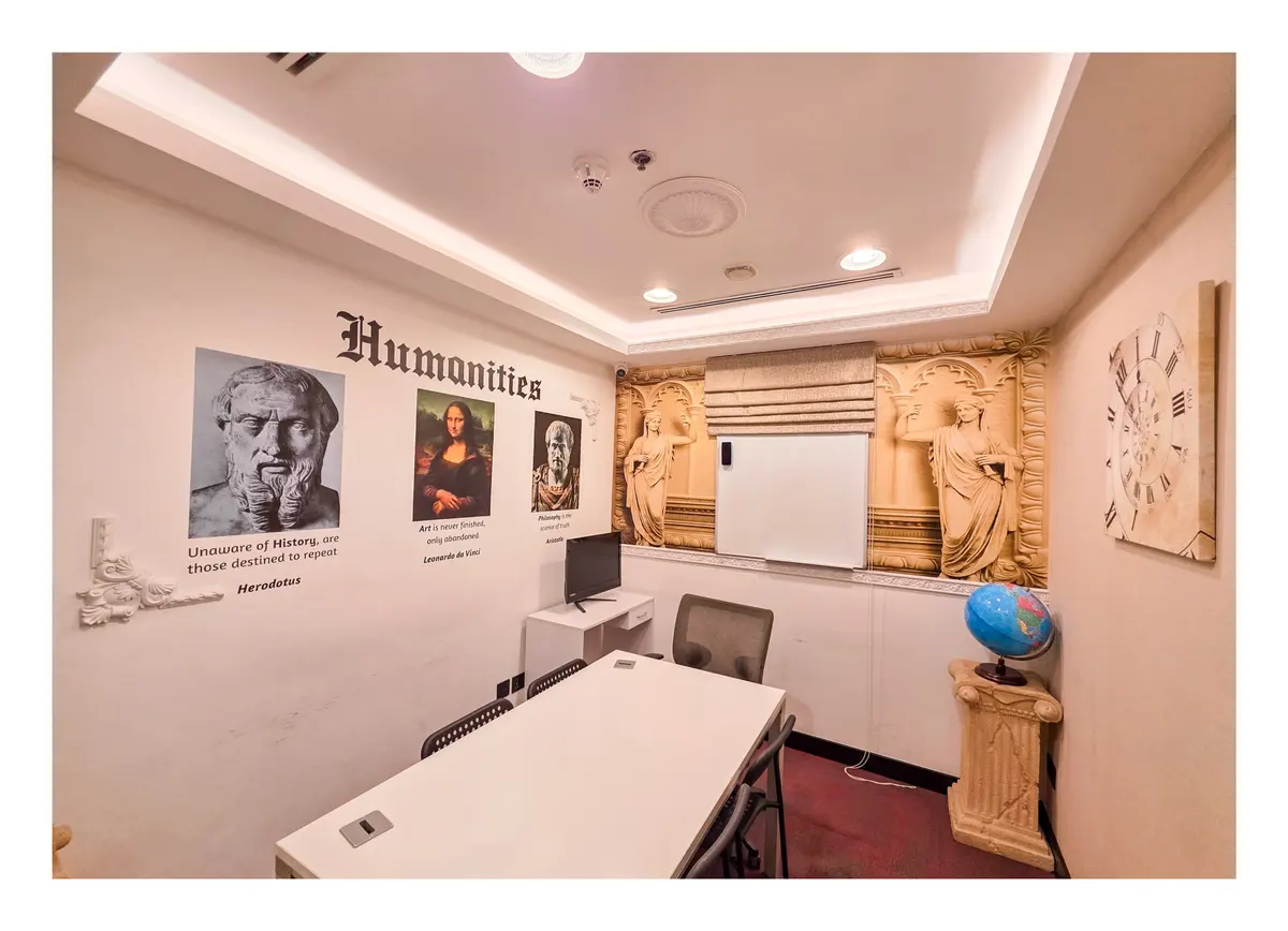 Humanities classroom with classical art and a globe at Improve ME Institute