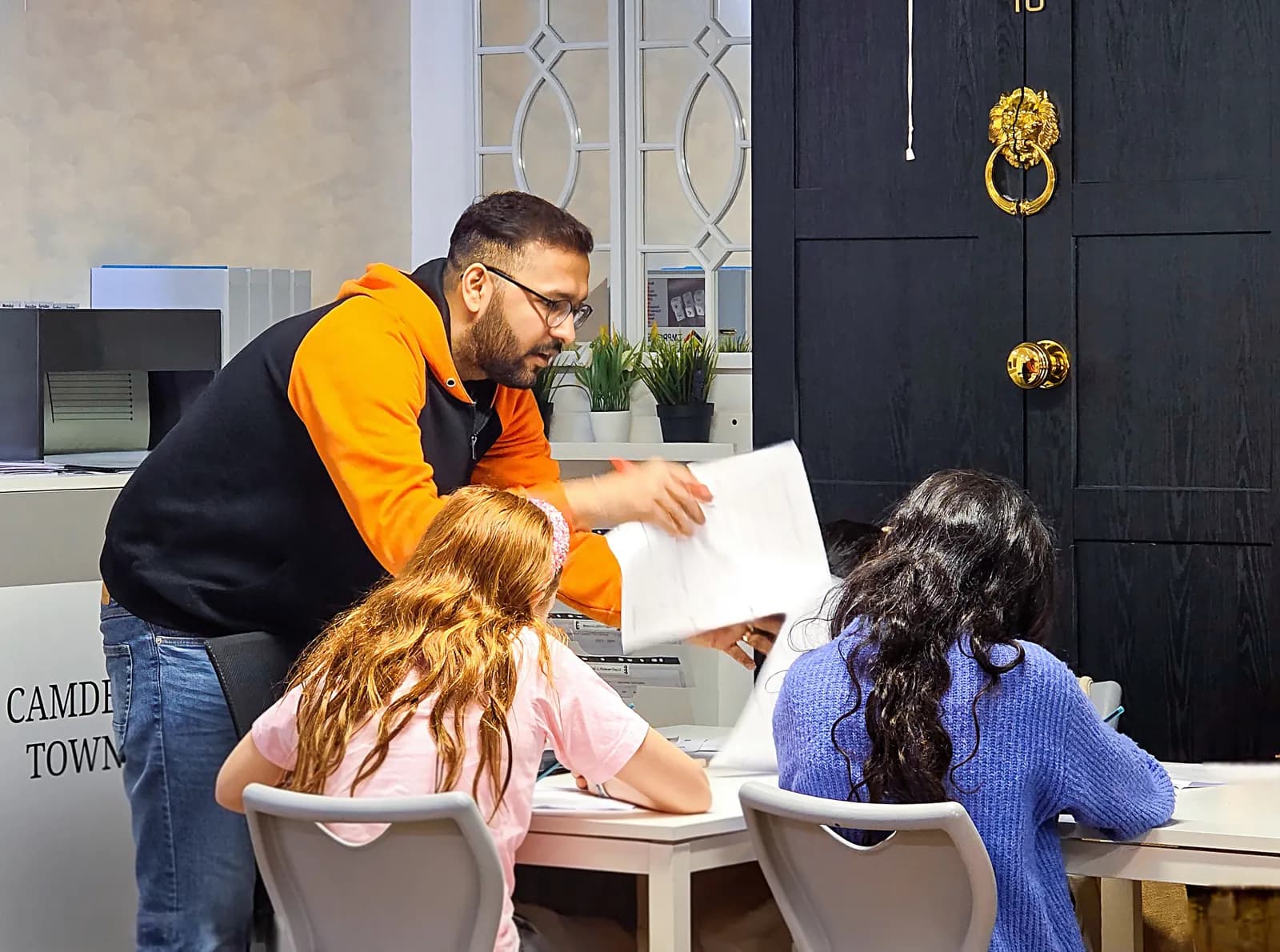 A teacher guiding Year 5 students during a Maths group class at Improve ME Institute