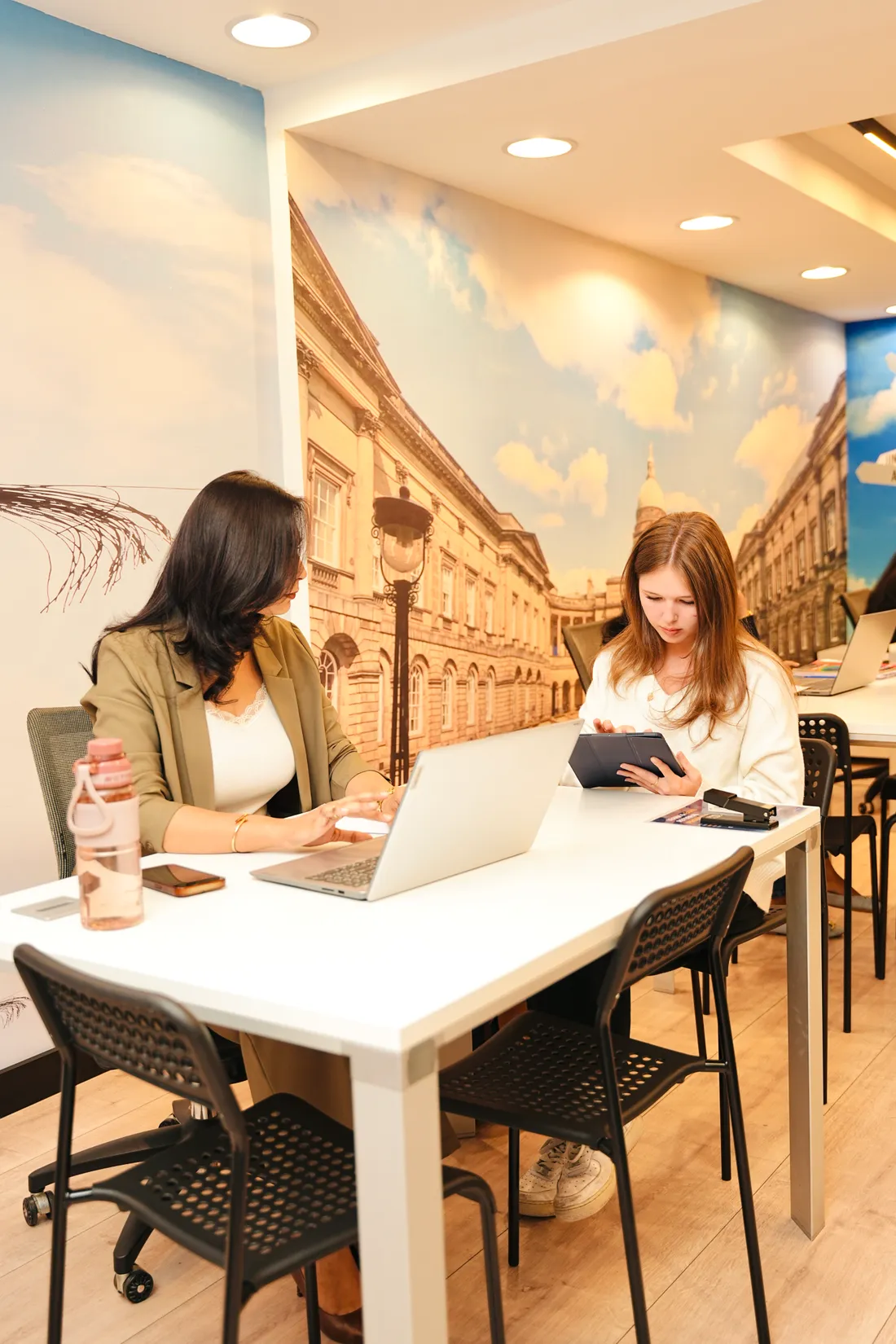 Students studying with a laptop and tablet at Improve ME Institute