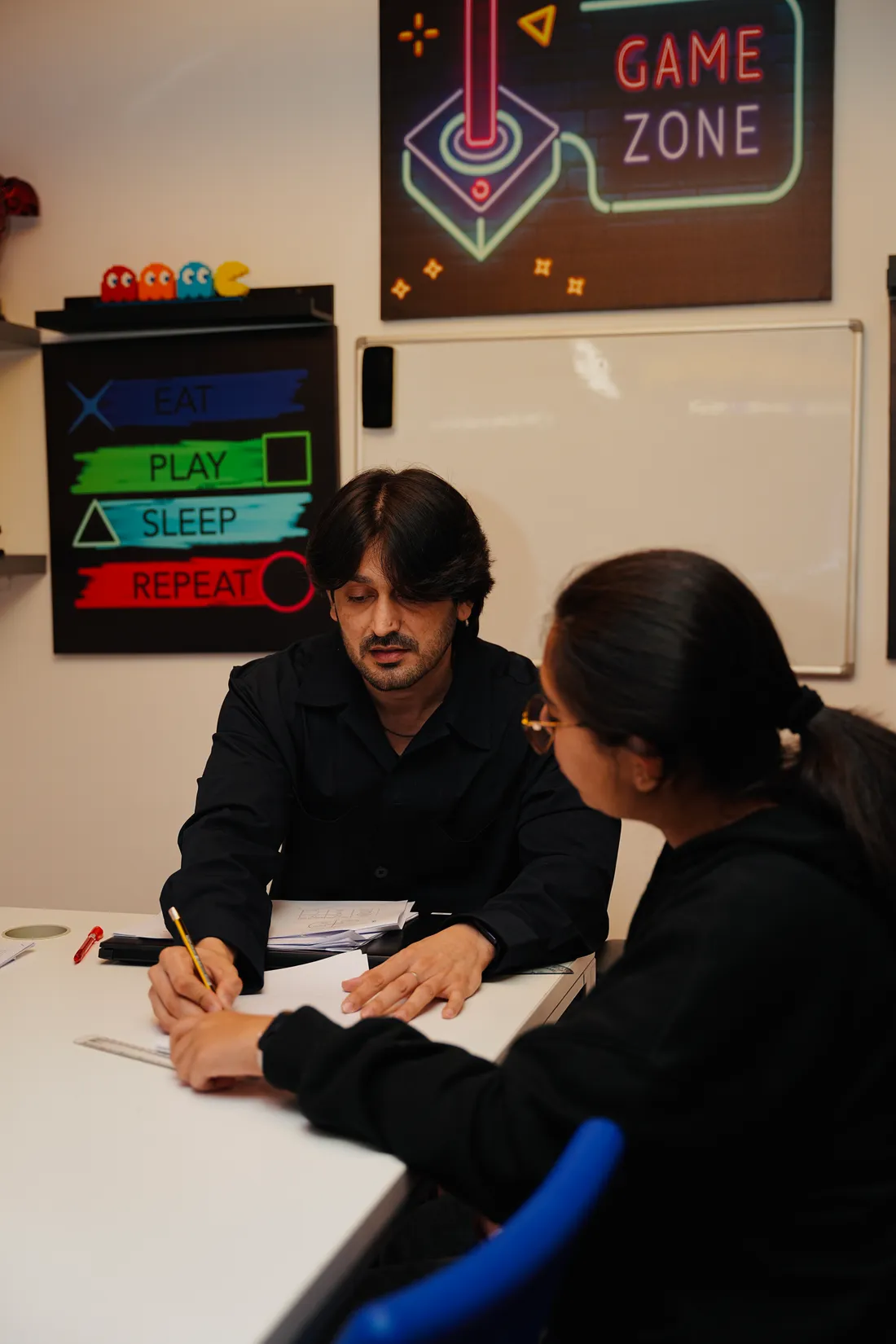 An Improve ME tutor working through a maths problem with a student