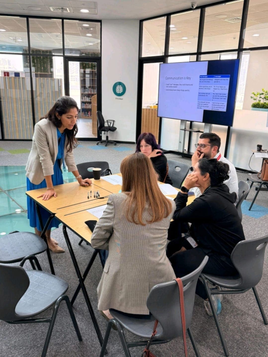 Neelam leading a parenting workshop with a group of parents